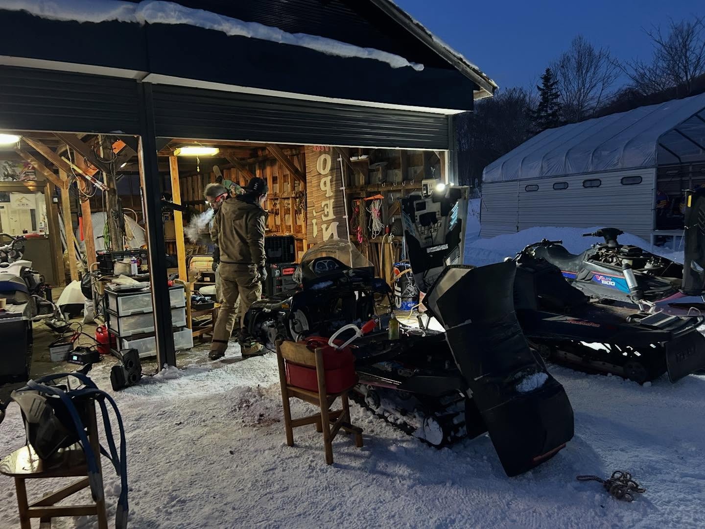 Working on the machines in the garage at dusk
